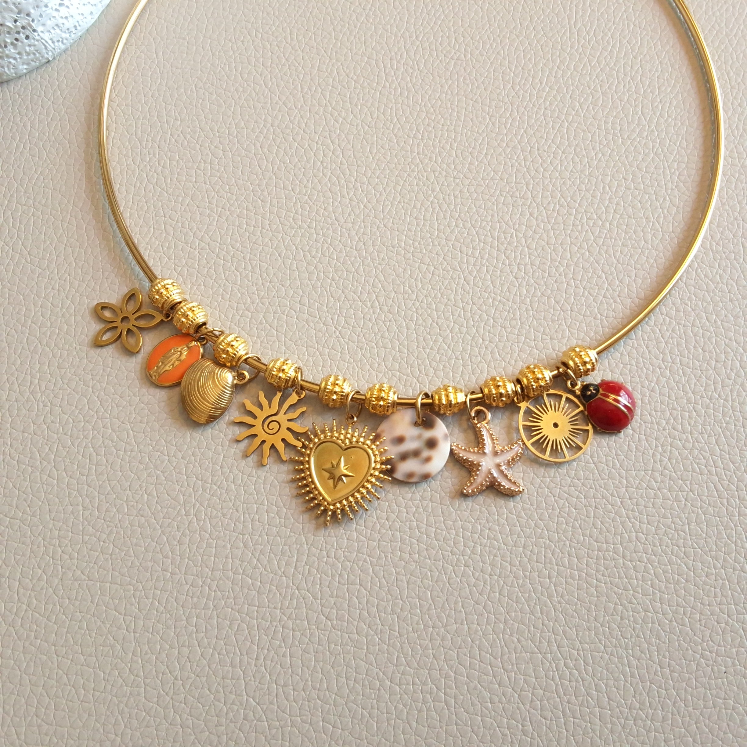 Bangle necklace with charms