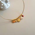 Bangle necklace with charms